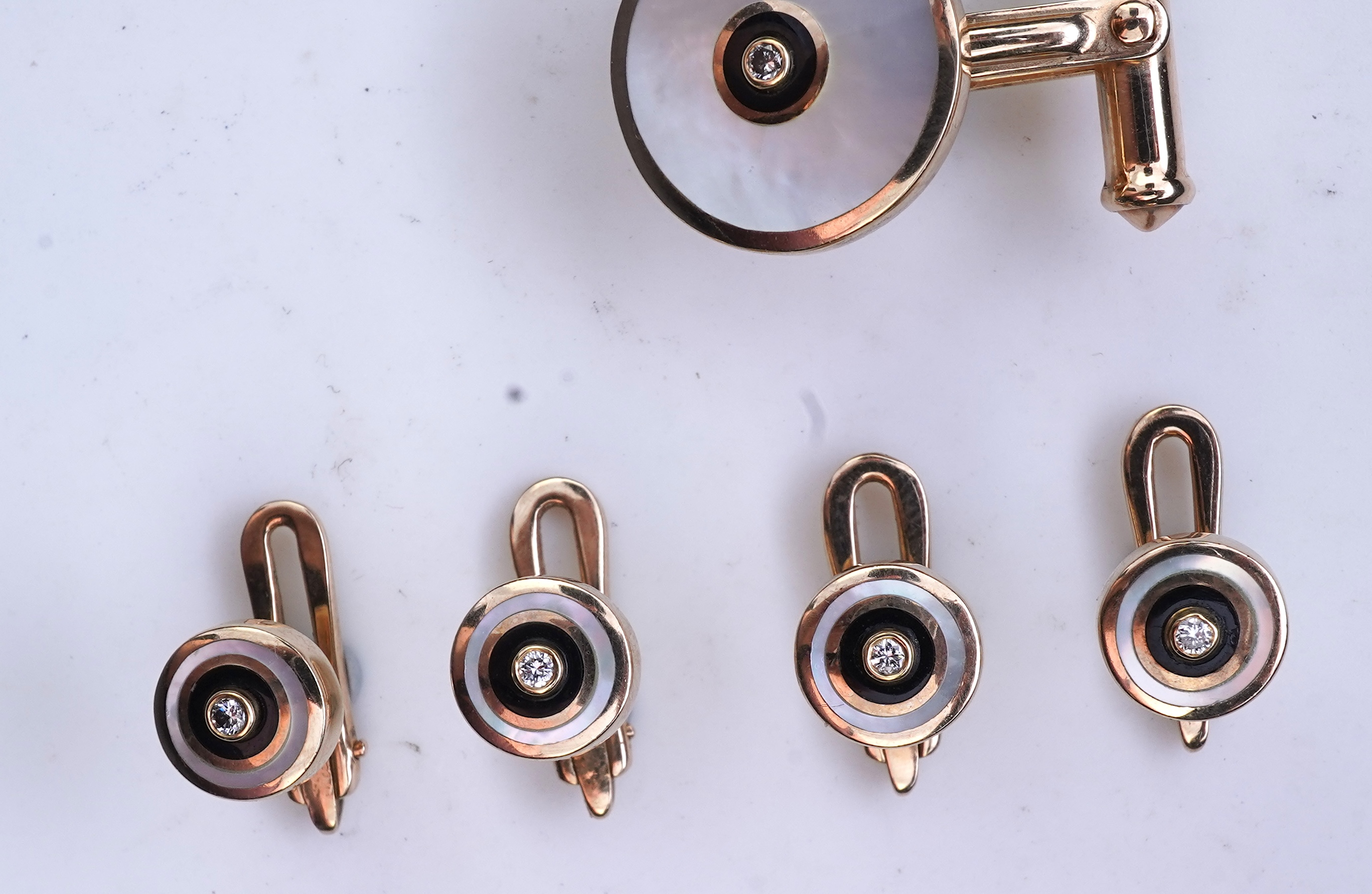 A mother of pearl and diamond dress set